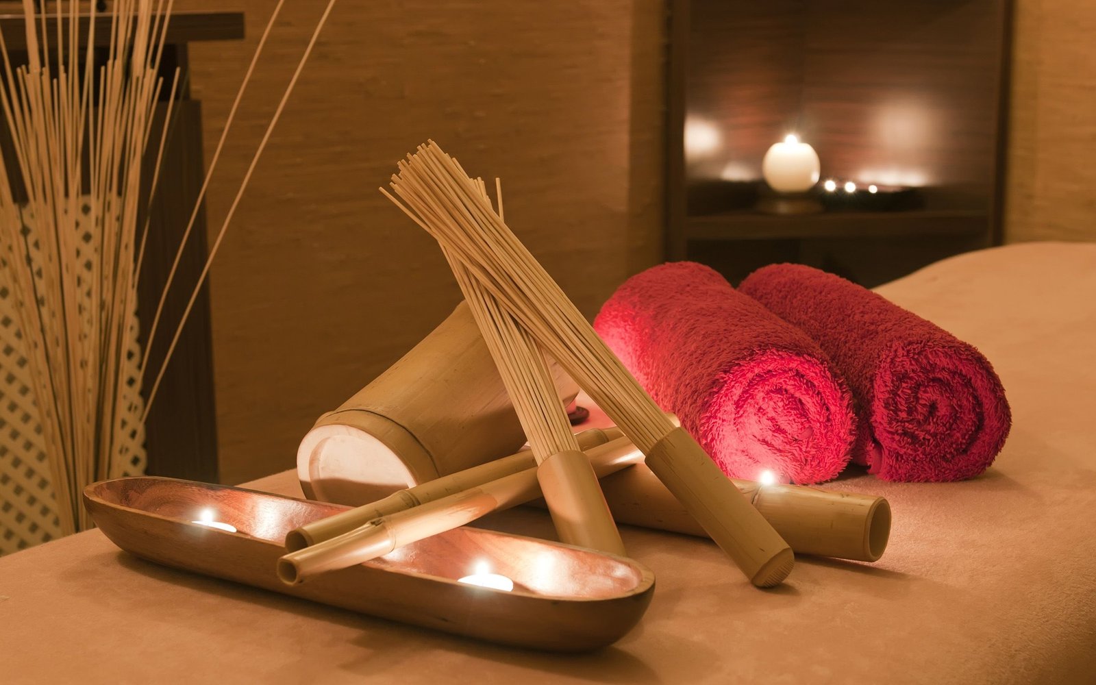 Relaxing Spa Setting with candles and towels